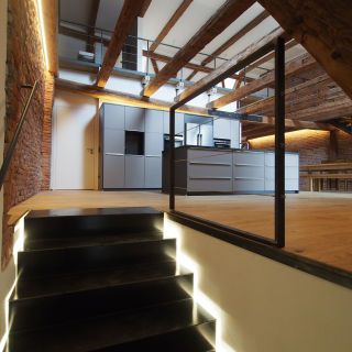 Dachgeschossausbau im bestehenden Wohn- und Geschäftshaus