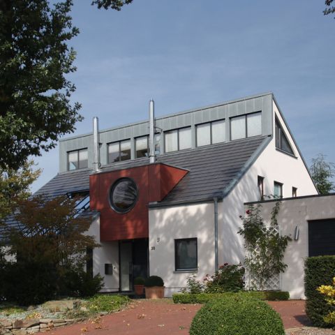 Umbau eines Wohnhauses und Teilaufstockung des Daches